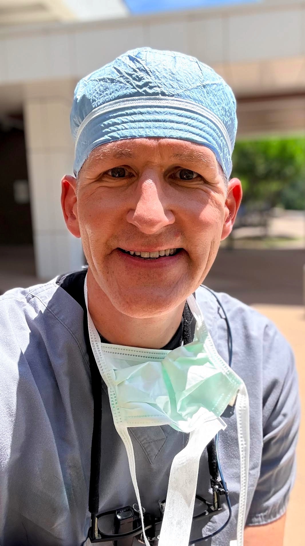 Lee Reichel, M.D. in surgical cap